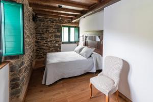 Postel nebo postele na pokoji v ubytování Apartamentos Rurales Casa Llongo