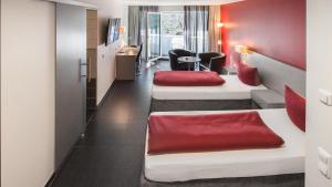 Postel nebo postele na pokoji v ubytování Hotel Zur Post