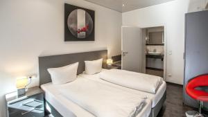 Postel nebo postele na pokoji v ubytování Hotel Zur Post