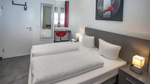 Postel nebo postele na pokoji v ubytování Hotel Zur Post