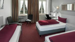Postel nebo postele na pokoji v ubytování Hotel Zur Post