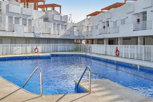 a swimming pool in front of a building at Pierre & Vacances Mojácar Playa in Mojácar
