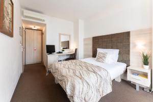 מיטה או מיטות בחדר ב-Hotel Antares