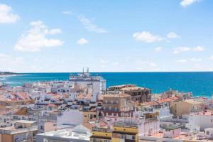 a view of a city with the ocean in the background at Timeless Sea I Apartment in Armação de Pêra