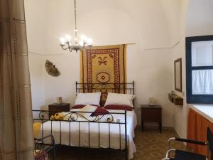 Postel nebo postele na pokoji v ubytování I dammusi di sottokuddia