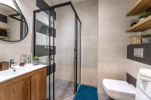 Ένα μπάνιο στο Apartament Słoneczny Poranek