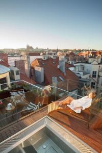 a view of a roof with people sleeping on the deck at The Emblem Prague Hotel - Preferred Hotels & Resorts in Prague