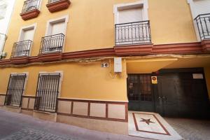 a building with a star in front of it at El Coso Boutique Lucena in Lucena