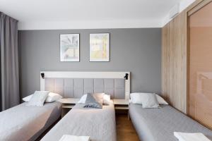 Posteľ alebo postele v izbe v ubytovaní Wolska Residence