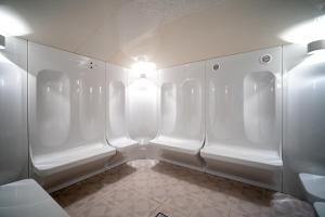 Ванная комната в Одиссея Wellness Resort