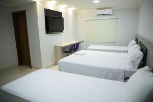 Postel nebo postele na pokoji v ubytování Hotel Uipi