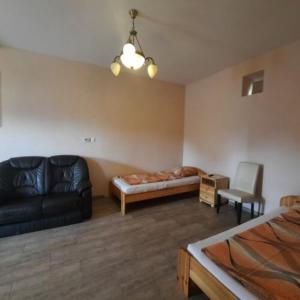 A bed or beds in a room at IKSZT Vendégház