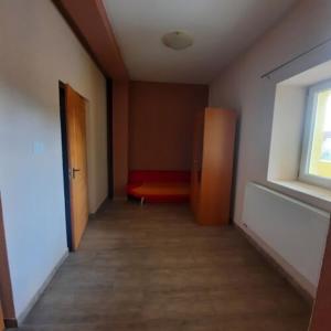 A bed or beds in a room at IKSZT Vendégház