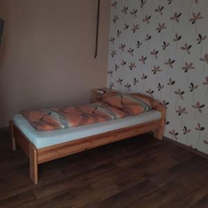 A bed or beds in a room at IKSZT Vendégház