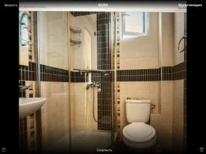 a bathroom with a toilet and a shower and a sink at Imperia in Bar +65 photos