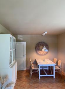 a dining room with a table and chairs at Auszeit am Lindenpark in Kühlungsborn