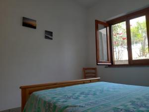 Postel nebo postele na pokoji v ubytování Villa Nausica