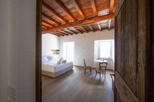 Postel nebo postele na pokoji v ubytování Casa Castagna 1620
