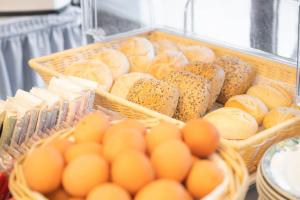 a bunch of bread and eggs in baskets at Hotel Astoria am Urachplatz in Stuttgart