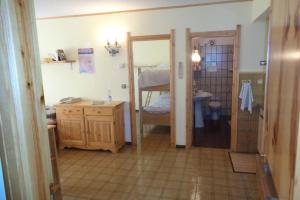 A bed or beds in a room at Intero appartamento in stile montagna