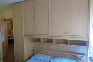 A bed or beds in a room at Intero appartamento in stile montagna