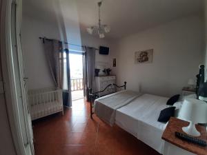 a bedroom with a large bed and a window at La Cupoletta -Holiday House - GILDA in Trevignano Romano