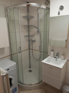 a bathroom with a shower and a sink at Apartament 26 in Drawsko Pomorskie +7 photos