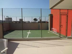 Tennis- en/of squashfaciliteiten bij Apartamento Aconchego - espaço acolhedor e confortável of in de buurt 