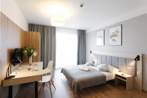 Posteľ alebo postele v izbe v ubytovaní Wolska Residence I