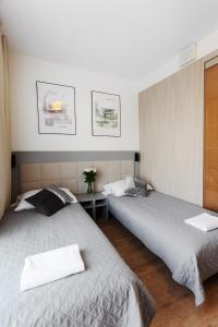 Posteľ alebo postele v izbe v ubytovaní Wolska Residence I