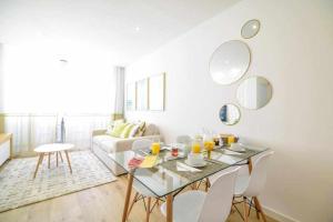 a living room with a table and a couch at Timeless Beach II Apartment in Armação de Pêra