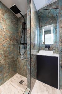 A bathroom at O'Lord, 4 Etoiles, Residence de Luxe Champs-Elysees