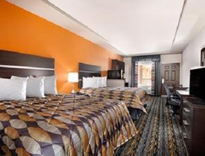 Postel nebo postele na pokoji v ubytování Days Inn by Wyndham Dilley + 22 fotografií