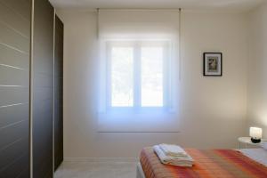 A bed or beds in a room at Appartamento Zappacenere