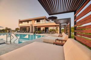 a villa with a swimming pool and a house at San Servolo Wellness Homes in Buje