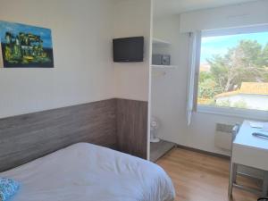 Кровать или кровати в номере Hotel Atlantique