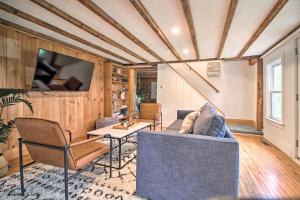 a living room with a couch and a table at Renovated Farmhouse Less Than 1 Mile to Okemo Mountain! in Ludlow
