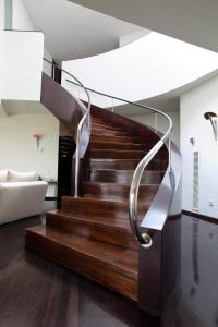 a spiral staircase in a living room with a couch at Villa Rock in Barcelona