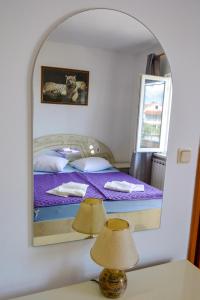 Postel nebo postele na pokoji v ubytování Apartmani Zlata