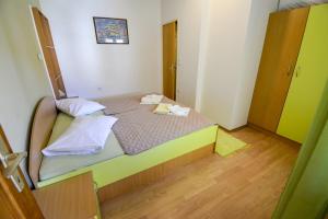 Postel nebo postele na pokoji v ubytování Apartmani Zlata