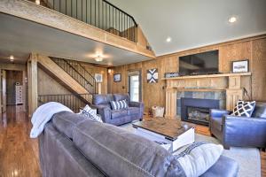 a living room with a couch and a fireplace at The Front Porch 20-Acre Country Home with Mtn View in Red Lodge