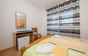 Posteľ alebo postele v izbe v ubytovaní Rooms Marijana