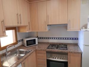 Kuchyň nebo kuchyňský kout v ubytování Paraiso Lido-Fincas Benidorm