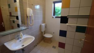 Koupelna v ubytování Apartmani Anita + 30 fotografií