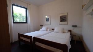 Postel nebo postele na pokoji v ubytování Apartmani Anita