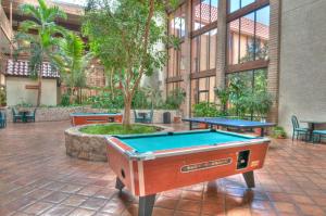 a pool table in the middle of a courtyard at MCM Elegante Suites Abilene in Abilene