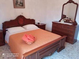 Ένα ή περισσότερα κρεβάτια σε δωμάτιο στο Casa Vacanze Da Nonna Maria