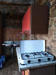 a kitchen with a stove and a sink at Calabria incontaminata in Gizzeria