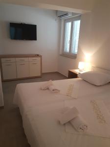 Postel nebo postele na pokoji v ubytování Bed & Breakfast Dora