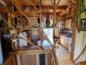a room with a spiral staircase in a tiny house at Під горою in Volovets